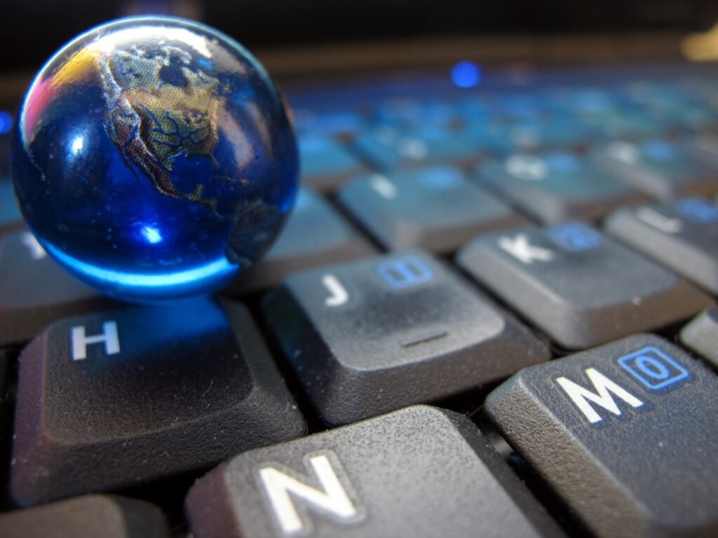 Marble globe on a keyboard for web design